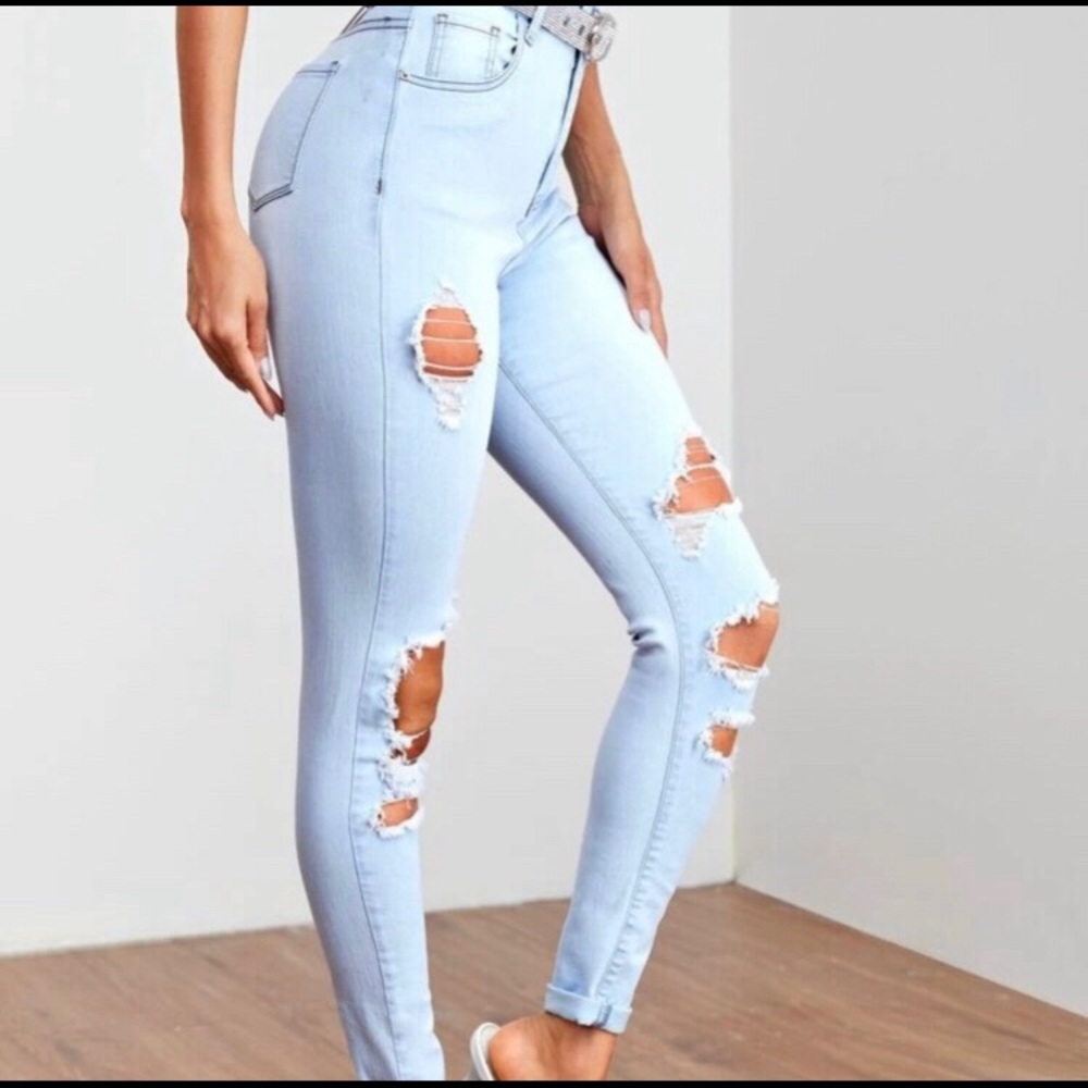 Light wash high waisted ripped women’s jeans